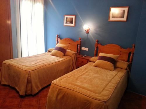 Cama ou camas em um quarto em Hostal Restaurante Asador Pañart