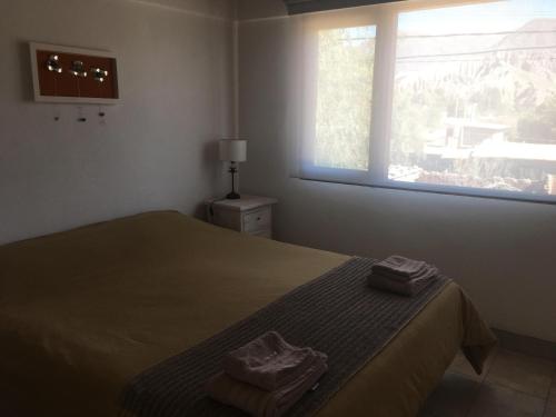 Cama o camas de una habitación en Cabañas La Sorpresa