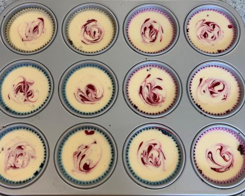 a muffin pan filled with cupcakes with chocolate frosting at B&B Beauty House in Cesena