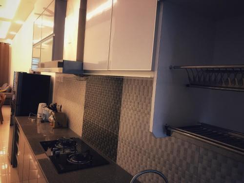 Kuchyň nebo kuchyňský kout v ubytování Arsyad Homestay Changlun