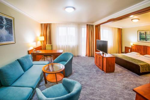 Posteľ alebo postele v izbe v ubytovaní Hotel Silver