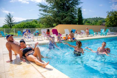 a group of people sitting in a swimming pool at VTF Le Domaine du Grand Luberon in Céreste