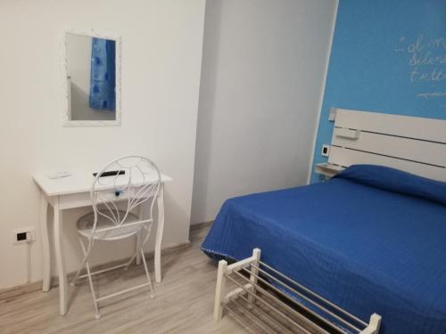 B&B La Collina Dei Poeti tesisinde bir odada yatak veya yataklar