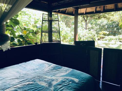 Ein Bett oder Betten in einem Zimmer der Unterkunft Serenity Beaches Resort