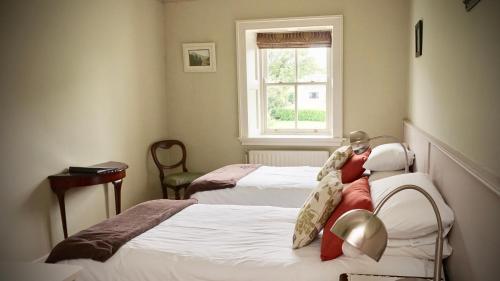 Postel nebo postele na pokoji v ubytování Cartron House
