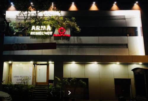 a building with a sign on the side of it at Hotel Arma Residency in Mumbai