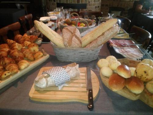a table with a bunch of bread and other foods at De Verloren Gernoare in De Panne