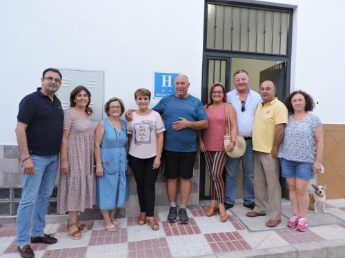a group of people standing in front of a building at Hostal Delia in Alora