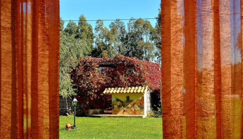 a painting of a building in a yard with trees at Agriturismo Monte Majore in Siliqua