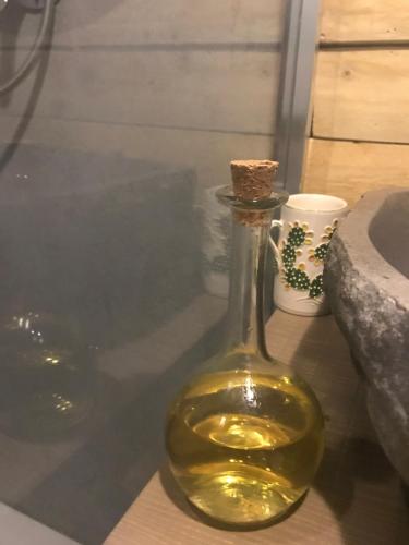 a bottle of wine sitting on top of a table at Bernardiniani Apartment in Molfetta