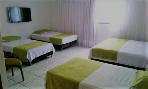 Postel nebo postele na pokoji v ubytování Hotel Florida Inn