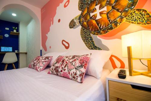 Voodi või voodid majutusasutuse Casa del Puerto Hostel & Suites toas