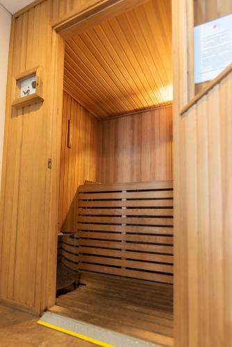a sauna with wooden walls and a wooden floor at Icaro Suites in Buenos Aires