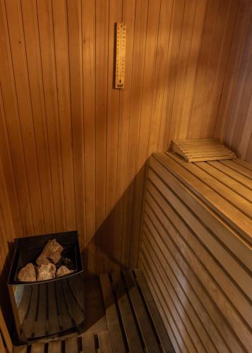 a inside of a sauna with a box of rocks at Icaro Suites in Buenos Aires