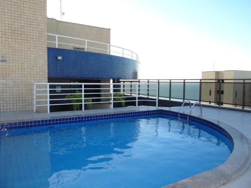 a large swimming pool in front of a building at Ocean Atlantic Praia de Iracema in Fortaleza