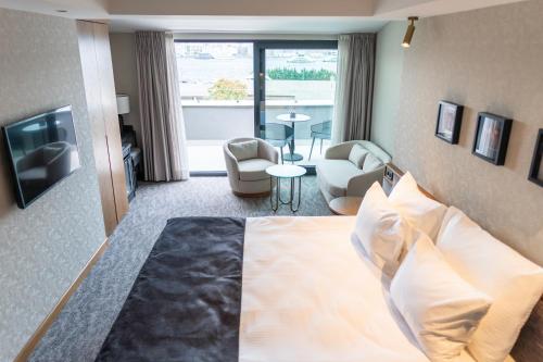 a hotel room with a bed and a living room at MEG HOTEL in Istanbul