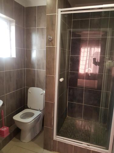 A bathroom at Durban Beach Getaway - Summersands, Inverter for load shedding, free wifi & free Parking