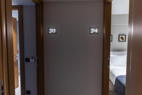a room with two doors with numbers on them at MEG HOTEL in Istanbul