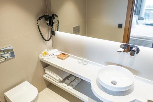 a bathroom with a sink and a mirror at MEG HOTEL in Istanbul