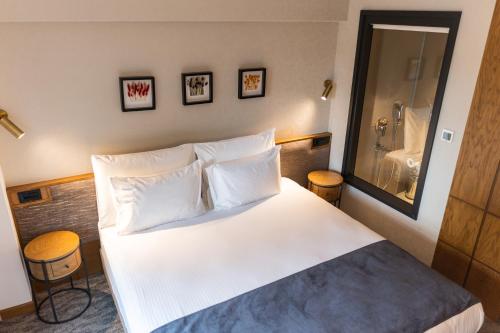 a hotel room with a bed and a bathroom at MEG HOTEL in Istanbul