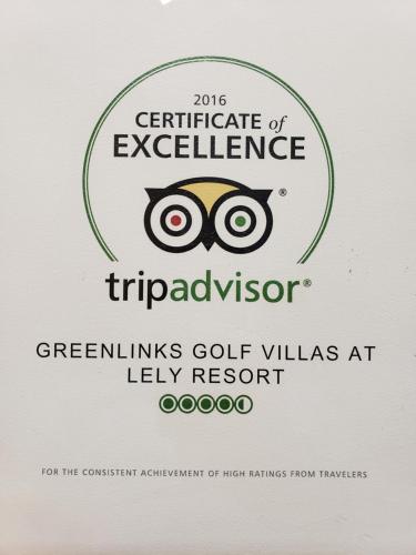 a sign with the certificate of excellence for the greenlins golf villas at at Vacation in Paradise in Lely Resort