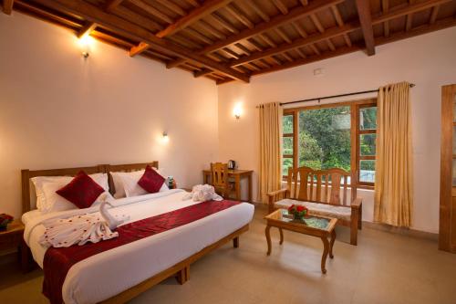 Postel nebo postele na pokoji v ubytování Bracknell Forest Munnar