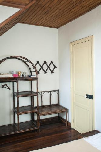 a room with two wooden shelves next to a door at Tsara Guest House in Fianarantsoa