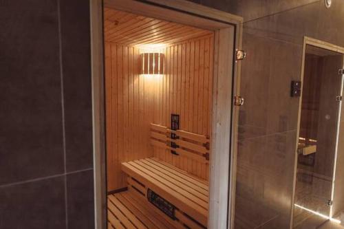 a bathroom with a sauna with a light on it at Centrum Rekreacji i Rehabilitacji Jubilat Sp.zo.o in Wisła