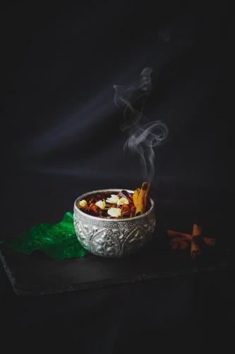 a bowl of food with smoke coming out of it at Eleven Hotel Bangkok Sukhumvit 11 in Bangkok