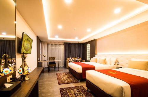 Giường trong phòng chung tại Alfahad Hotel