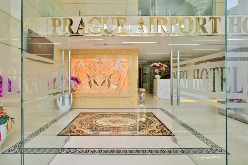 a store front with a large painting on the wall at Prague Saigon Airport Hotel in Ho Chi Minh City