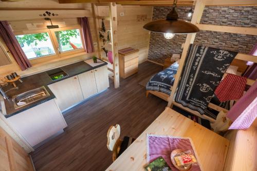 an overhead view of a kitchen and living room in a tiny house at Camping Danica Cottage Stan in Bohinj