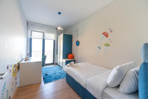 Katil atau katil-katil dalam bilik di Green Hills Suites