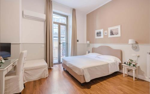 Postel nebo postele na pokoji v ubytování Miramare Hotel
