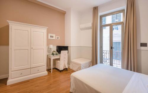 Postel nebo postele na pokoji v ubytování Miramare Hotel