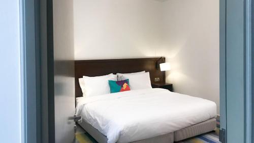 Katil atau katil-katil dalam bilik di Atana Stay Salalah