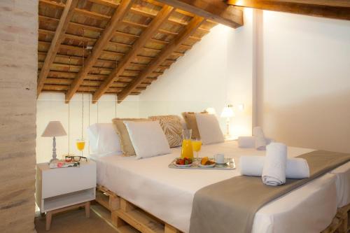 a bedroom with two beds with a tray of food on it at SingularStays Gulliver in Valencia