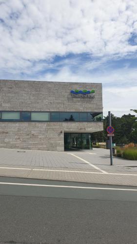 a building with a sign on the front of it at Bed and Pool in Oberursel