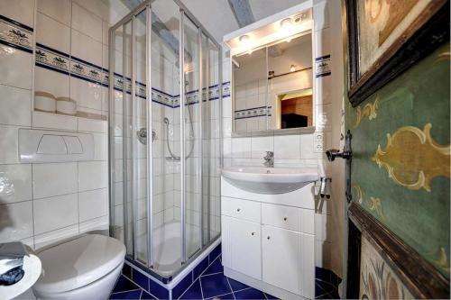 a bathroom with a toilet and a sink and a shower at Ferienhäuser Reither Almen in Reith im Alpbachtal