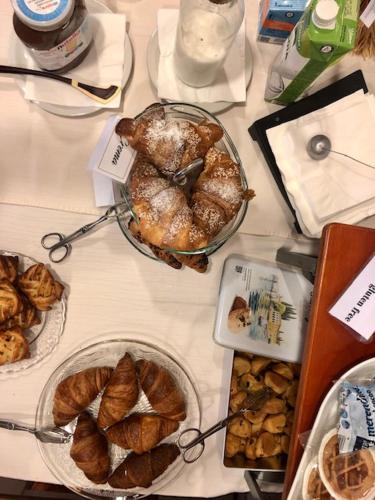 a table with several plates of pastries and other foods at RTA Doria in Garda