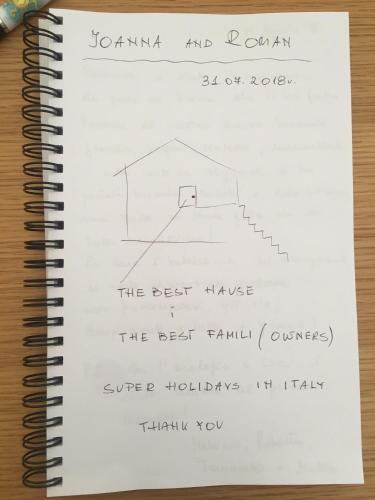 a notebook with a drawing of a house at La Casa del Sole in Marina di Pisticci