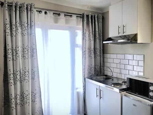Η κουζίνα ή μικρή κουζίνα στο Selton Guesthouse