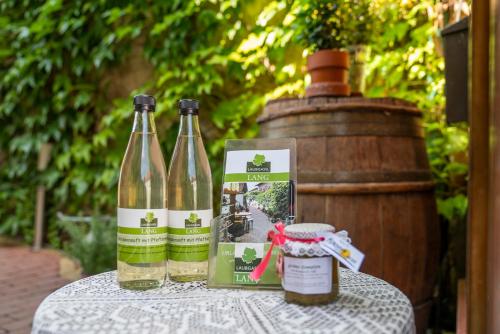 two bottles of wine sitting on top of a table at Laubgassl in Mörbisch am See
