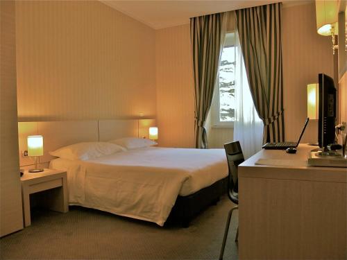 מיטה או מיטות בחדר ב-Domus Park Hotel & SPA