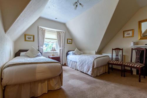 Кровать или кровати в номере Atholl Villa Guest House