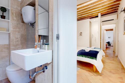 a bathroom with a sink and a toilet at Casa Modelli in Rome