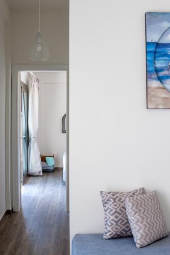 a living room with a bed and a room with a bedroom at Ktima Fabiatos in Skala Kefalonias