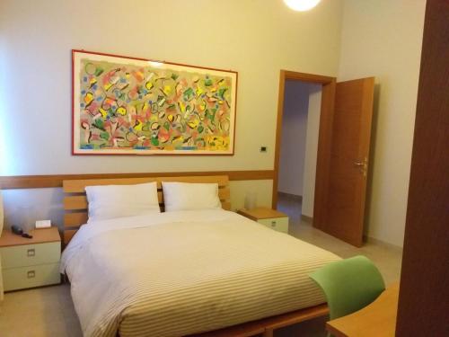 Ένα ή περισσότερα κρεβάτια σε δωμάτιο στο Il Melograno