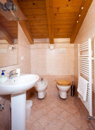 a bathroom with a sink and a toilet at Locazioni Turistiche By Max in Montegrotto Terme
