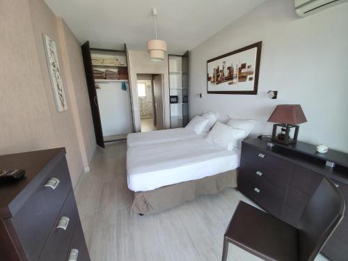 Cama ou camas em um quarto em Sun Marina Baie